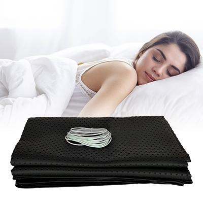 woman sleeping peacefully on Dreamzy Grounding Sheet